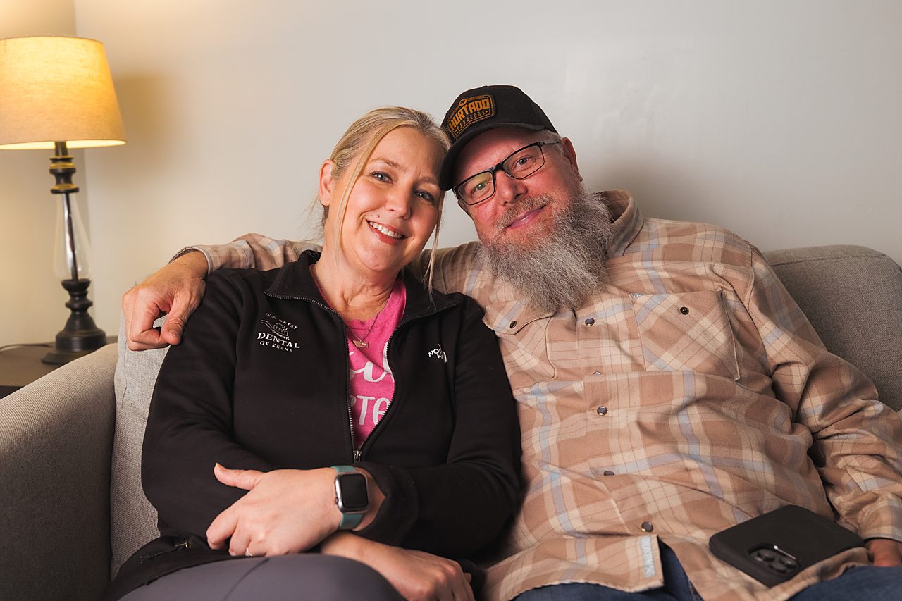 A smiling couple relaxing together, reflecting Old Betsy Dental's warm, family-oriented care